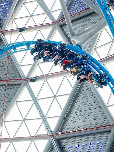 Riders on The Storm Coaster loop inside Dubai's indoor theme park.