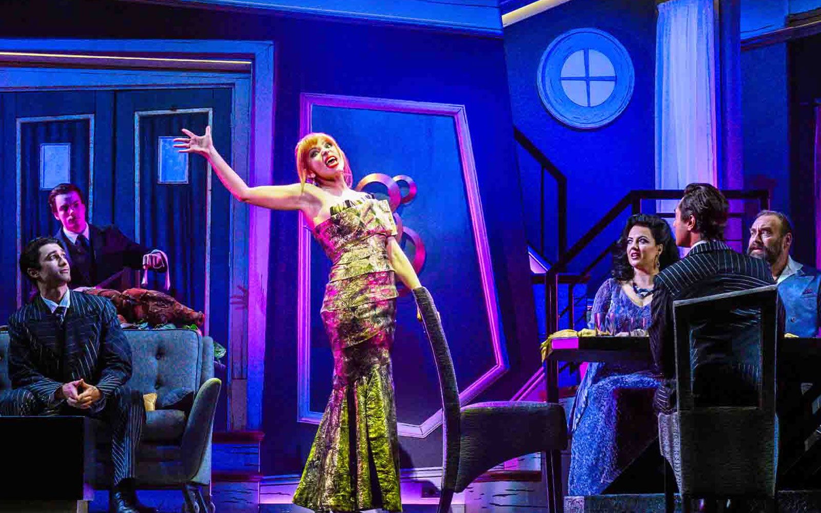 Stage performance of Beetlejuice show in Brisbane with actors in a vibrant set.