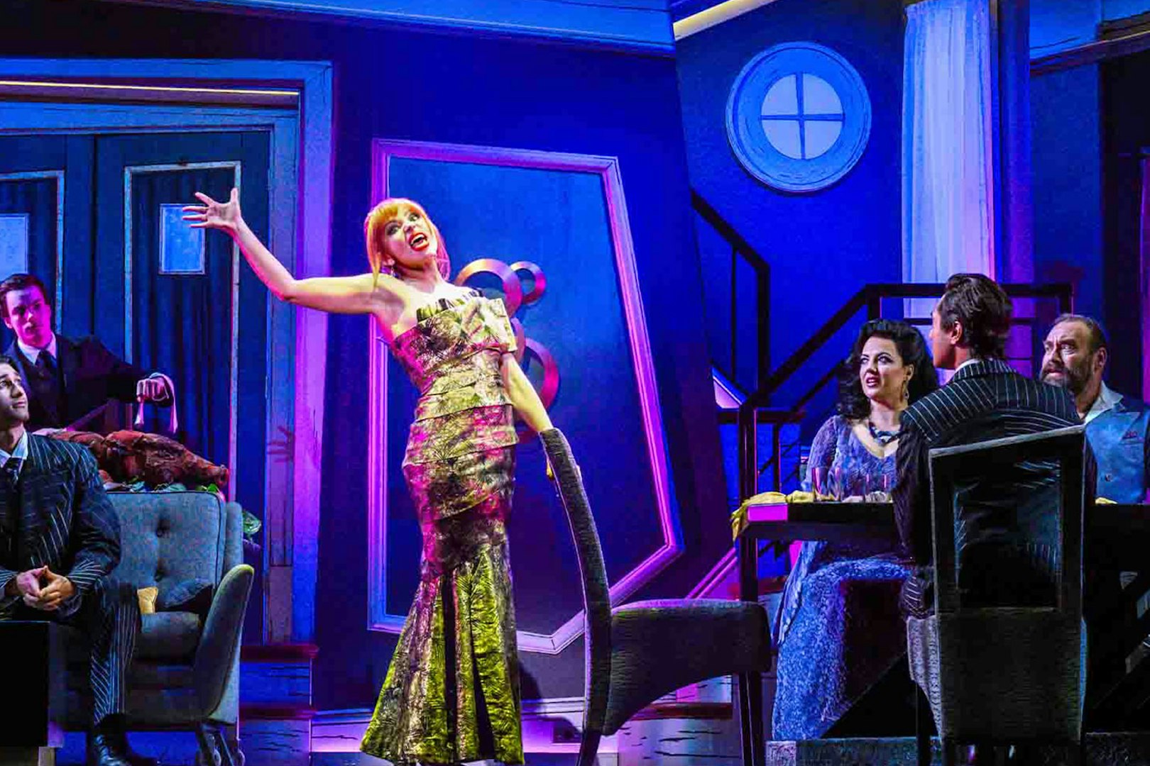 Stage performance of Beetlejuice show in Brisbane with actors in a vibrant set.