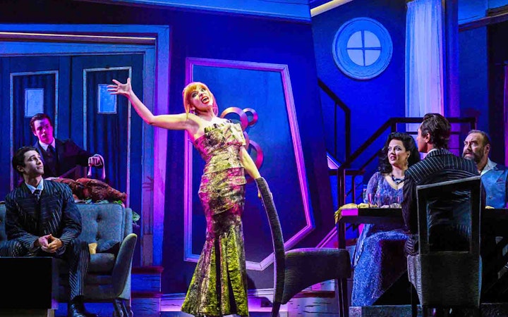 Stage performance of Beetlejuice show in Brisbane with actors in a vibrant set.