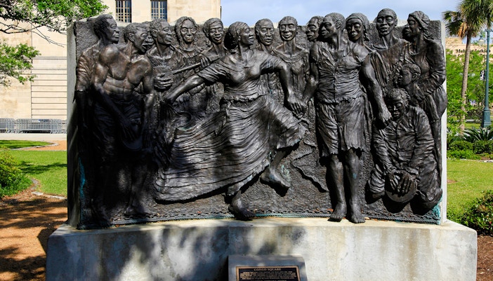 Musicians performing in Congo Square, New Orleans, showcasing vibrant cultural heritage.