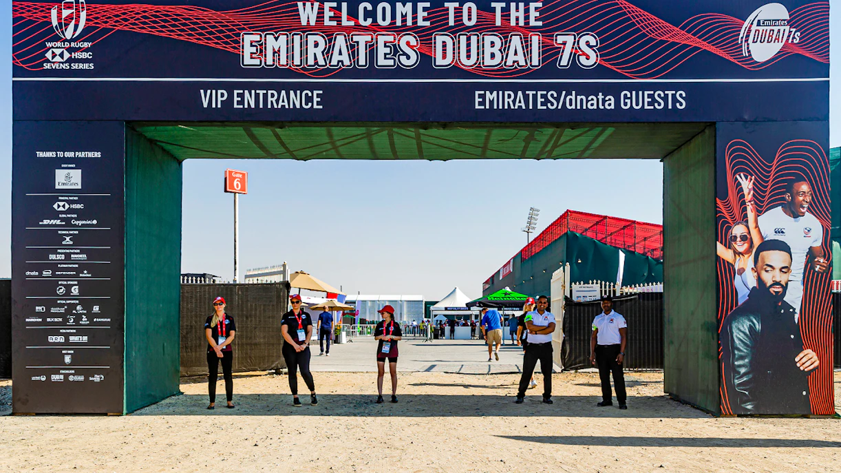 Entrance to Emirates Dubai 7s with staff and event signage, Gate 6 in background.