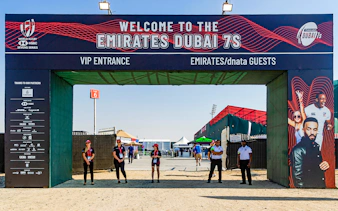 Entrance to Emirates Dubai 7s with staff and event signage, Gate 6 in background.