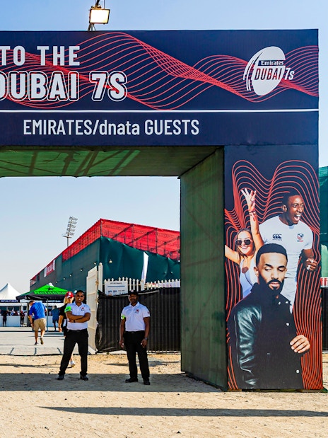 Entrance to Emirates Dubai 7s with staff and event signage, Gate 6 in background.