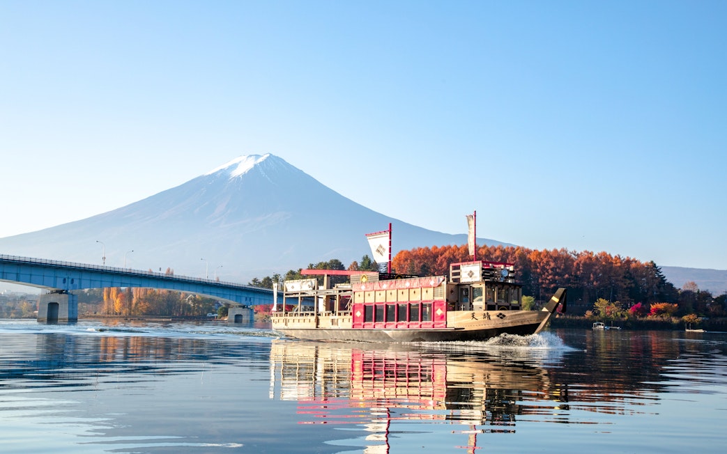 Tour boat on Lake Kawaguchiko with Mt. Fuji in the background.