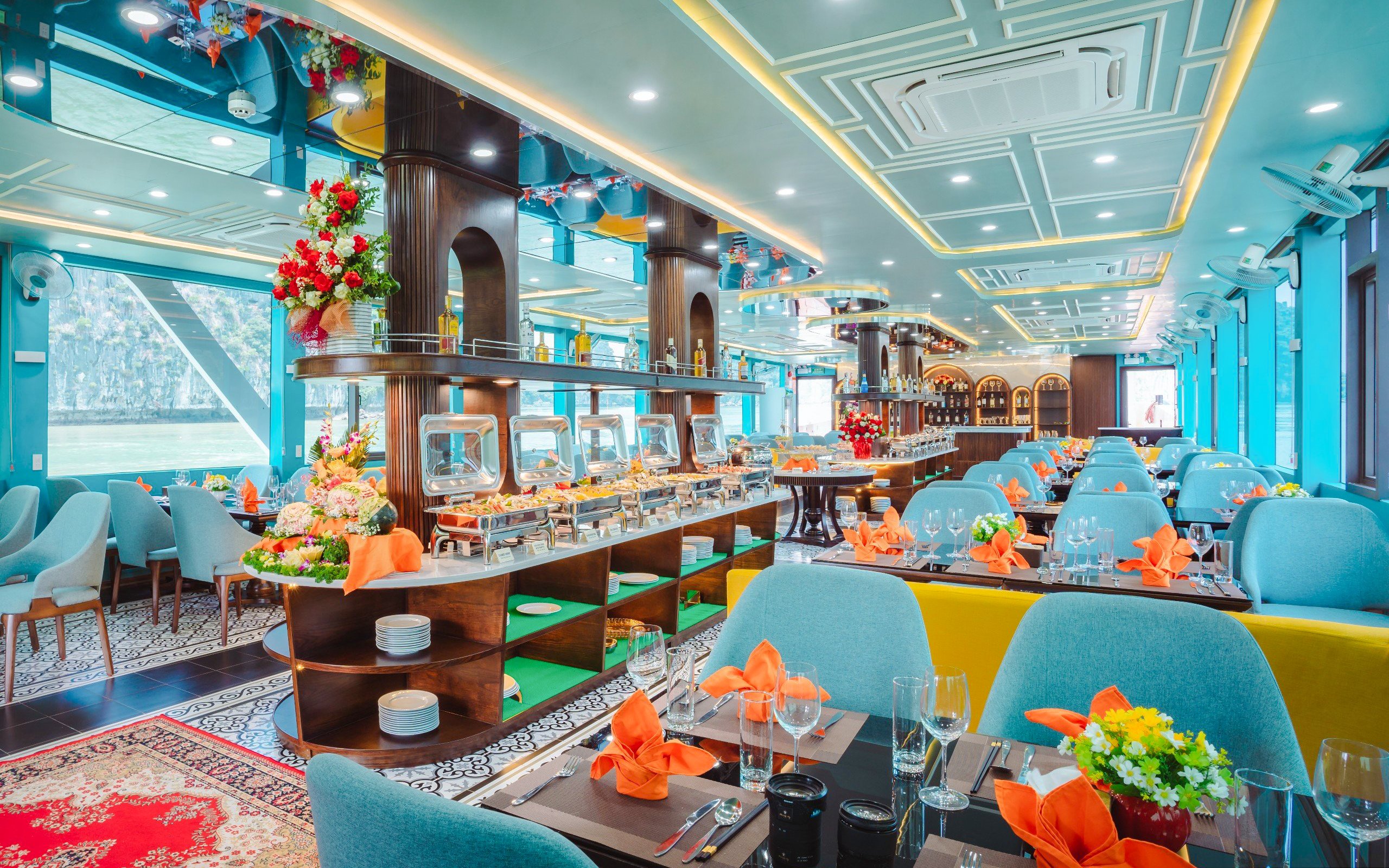 Dining area on Apollo Cruise 2 with buffet setup and elegant table settings.