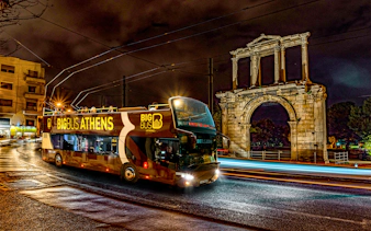 Big Bus Athens night tour passing Hadrian's Arch.
