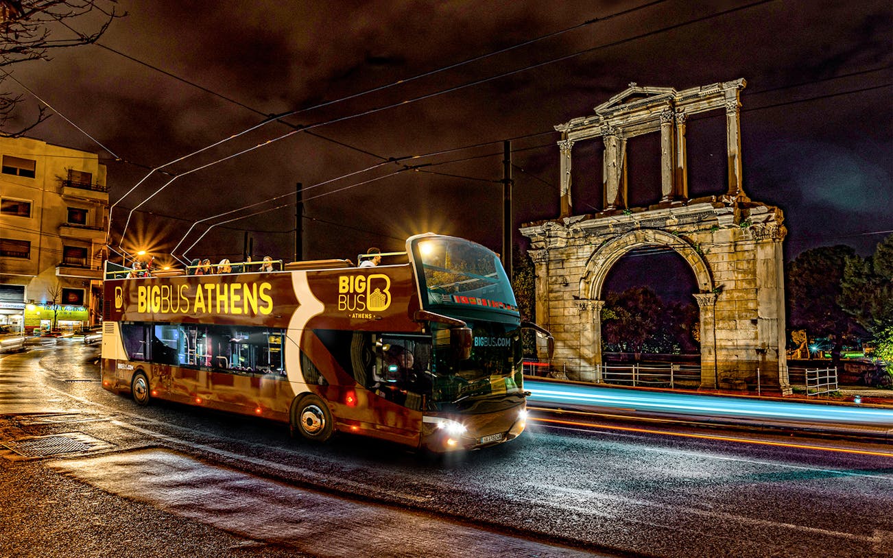 Big Bus Athens night tour passing Hadrian's Arch.