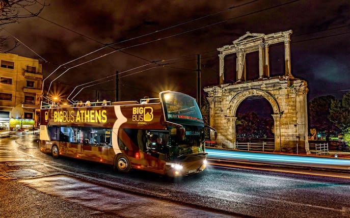 Big Bus Athens night tour passing Hadrian's Arch.