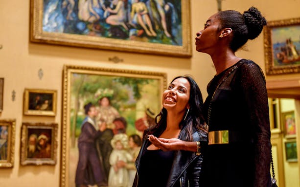Visitors admiring art at a Philadelphia museum, part of the CityPASS® tour.