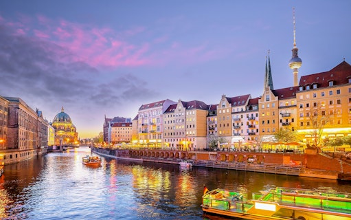 Berlin Cathedral and River Spree during evening sightseeing cruise.