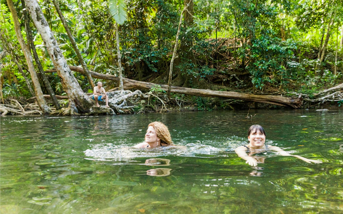 Swimming in a rainforest creek during the Great Barrier Reef and Daintree tour.