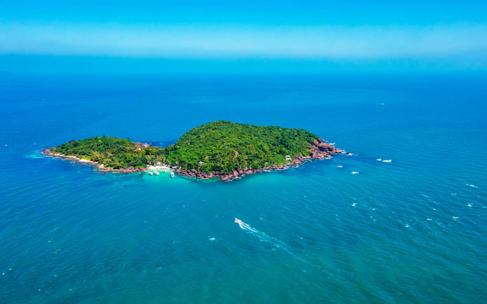 Aerial view of Xuong Island surrounded by turquoise waters in Phu Quoc, Vietnam.