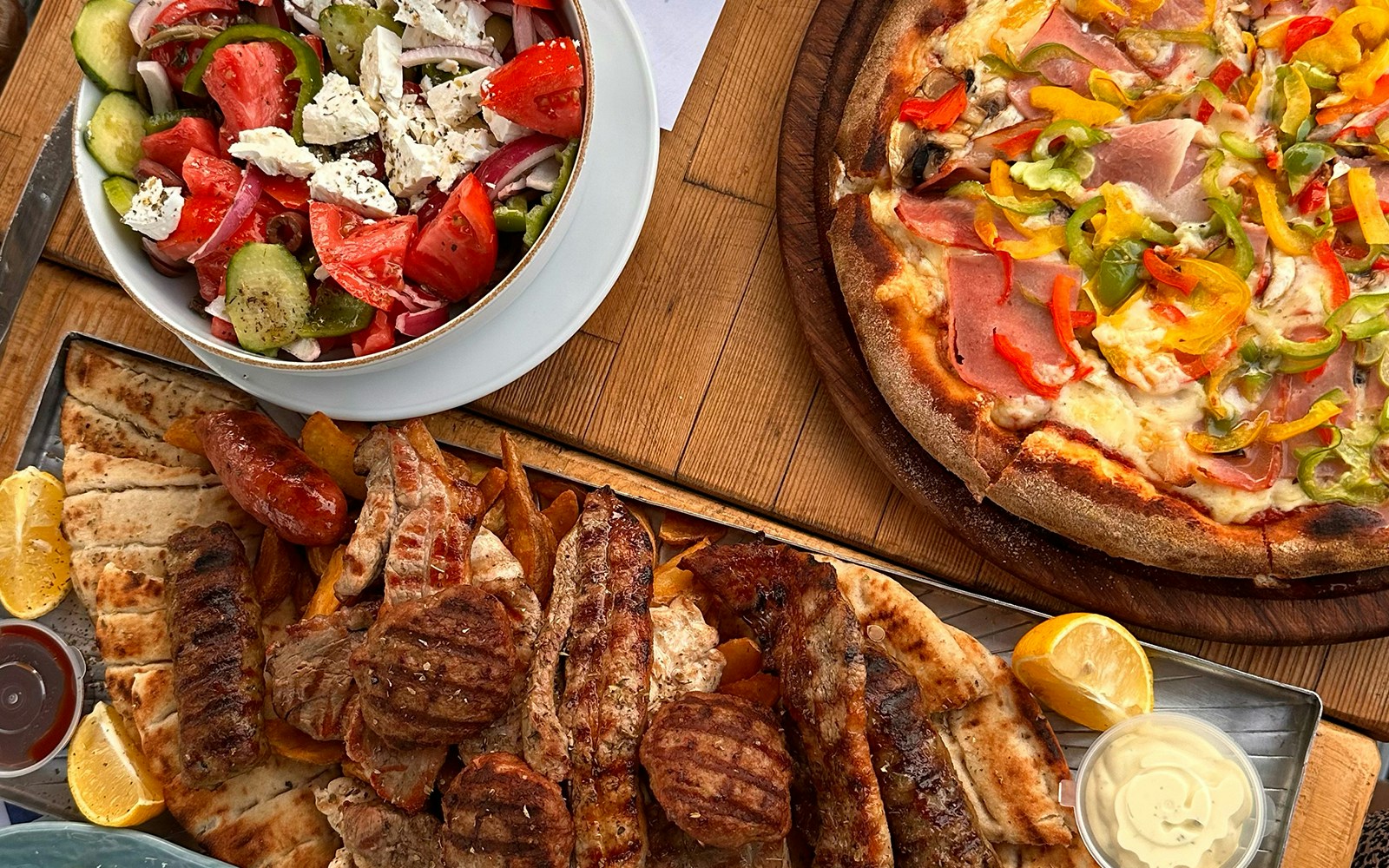 Flat lay photography of Pizza and Kebabs