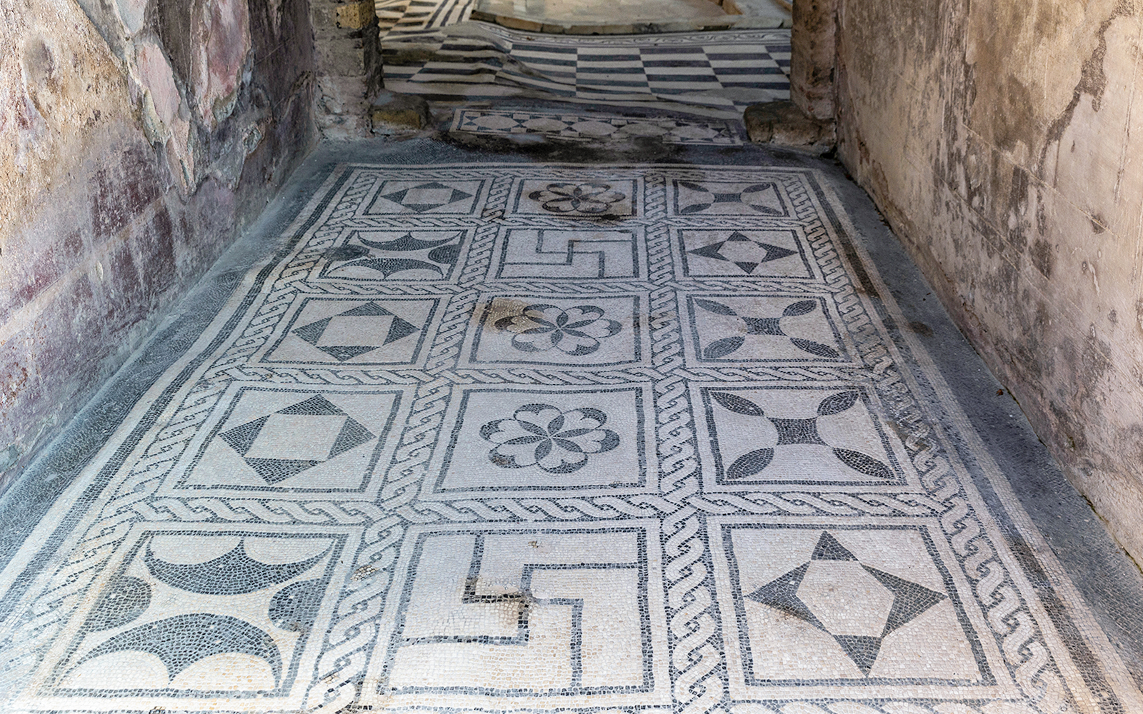 Herculaneum ancient floor frescoes with geometric patterns.