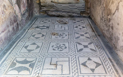 Herculaneum ancient floor frescoes with geometric patterns.