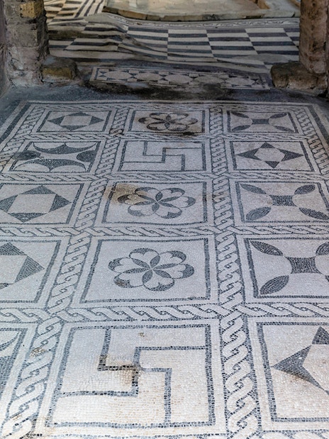 Herculaneum ancient floor frescoes with geometric patterns.