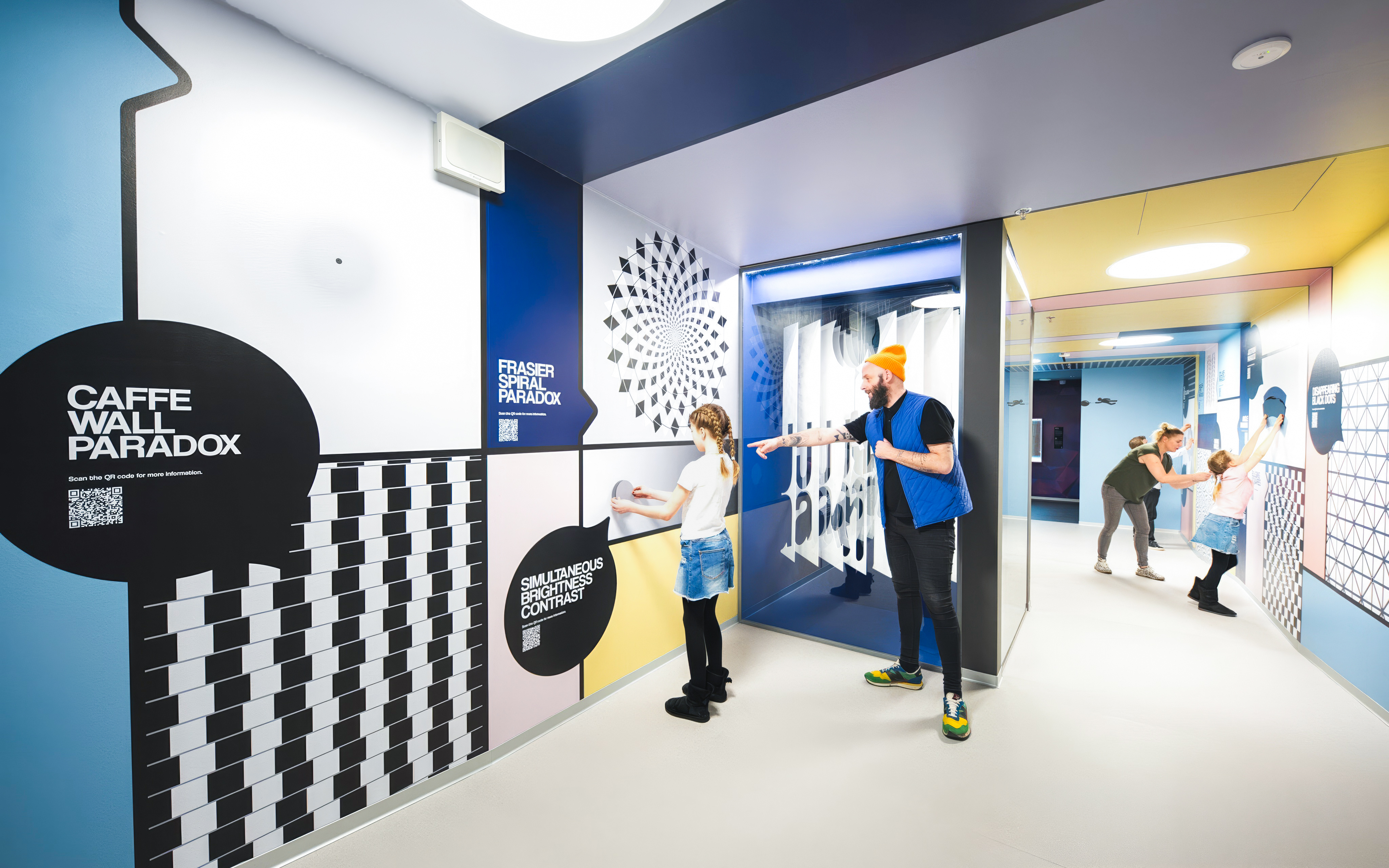 Visitors interacting with optical illusions at Paradox Museum Stockholm.