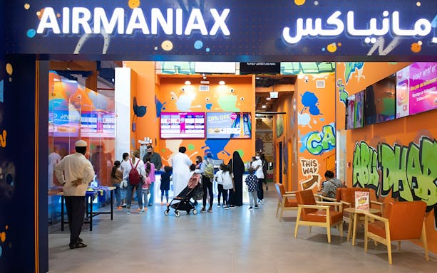 Visitors at Air Maniax Indoor Adventure Park entrance in Abu Dhabi.