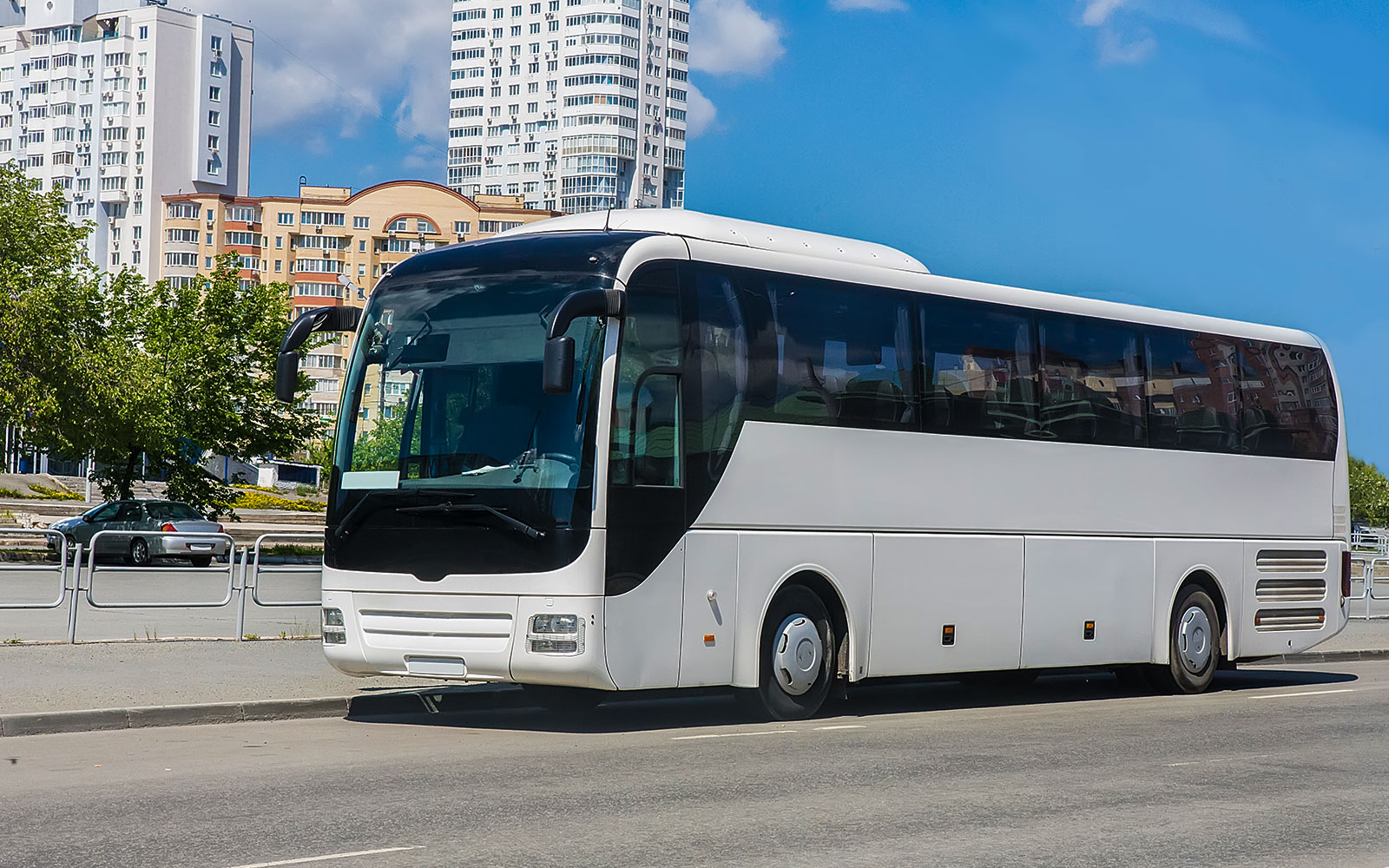 Shuttle bus parked on a city street, part of Istanbul Airport (IST) transfer service.