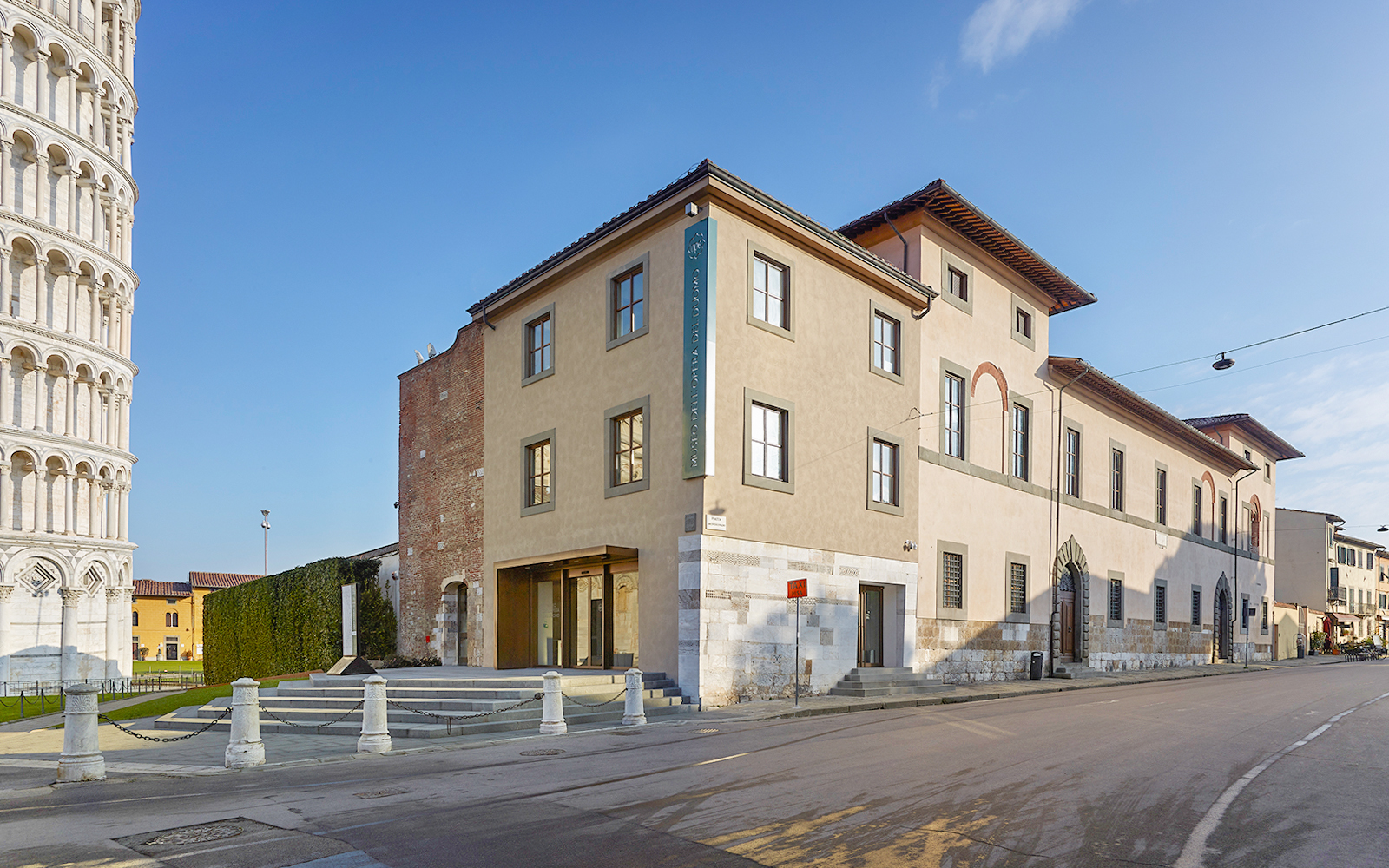 Opera del Duomo Museum exterior in Pisa with Leaning Tower visible nearby.