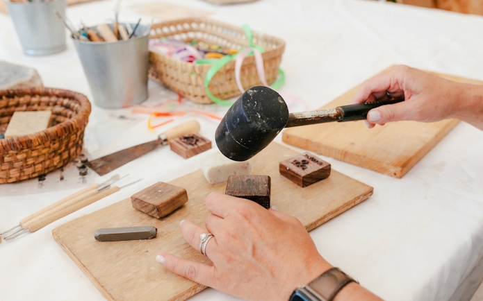 Crafting workshop with tools and stamps at Terre Ugo, Provence.