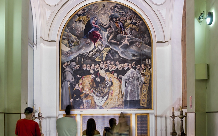 Visitors viewing El Greco's "The Burial of the Count of Orgaz" at Church of St. Tome, Toledo.