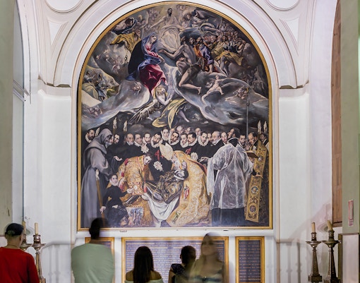 Visitors viewing El Greco's "The Burial of the Count of Orgaz" at Church of St. Tome, Toledo.
