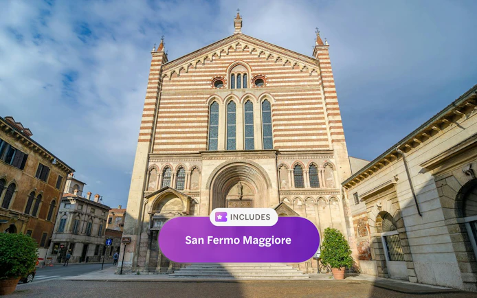 San Fermo Maggiore church facade in Verona, Italy, with striped brickwork and arched windows.