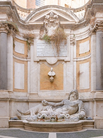 Statue of reclining river god at Roman Empire Museum, Rome.