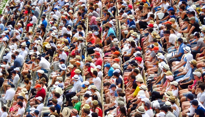 Spectators seated at Roland Garros tennis tournament in Paris.