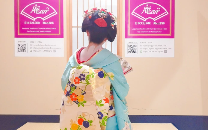Maiko in traditional kimono at a tea ceremony in Kyoto, Japan.