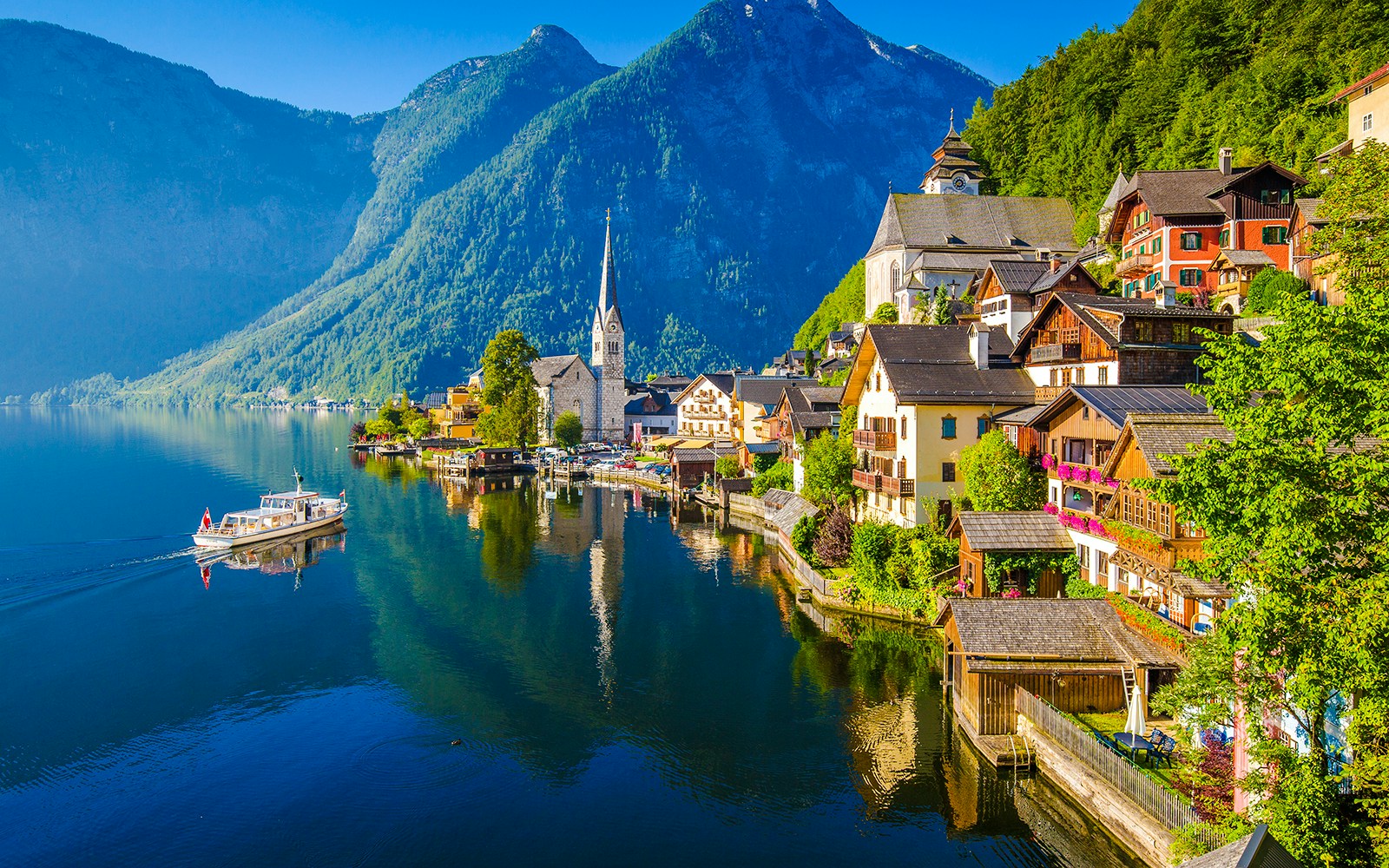 Hallstatt village by the lake with mountains in summer, Salzkammergut, Austria.