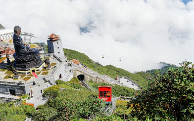 Cable car and Buddha statue at Sun World Fansipan Legend, Vietnam.