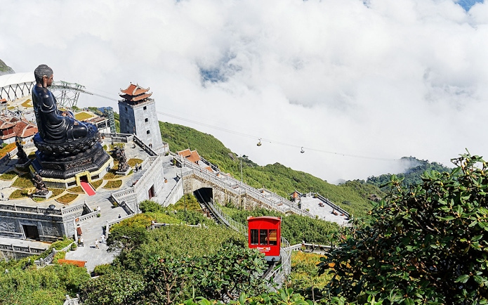 Cable car and Buddha statue at Sun World Fansipan Legend, Vietnam.