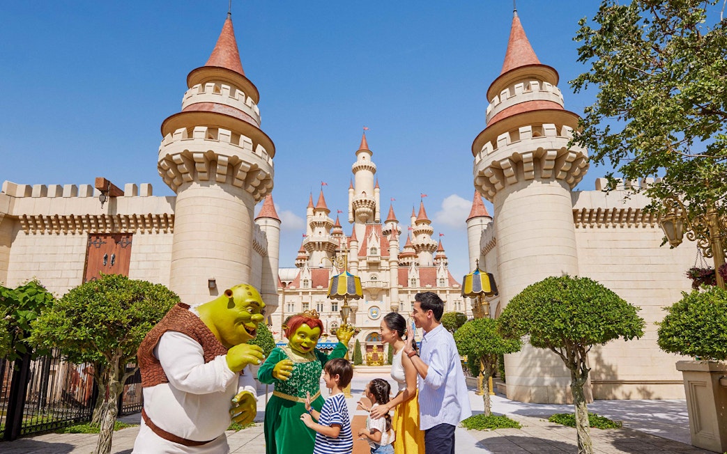 Characters from Shrek interacting with visitors at Universal Studios Singapore.