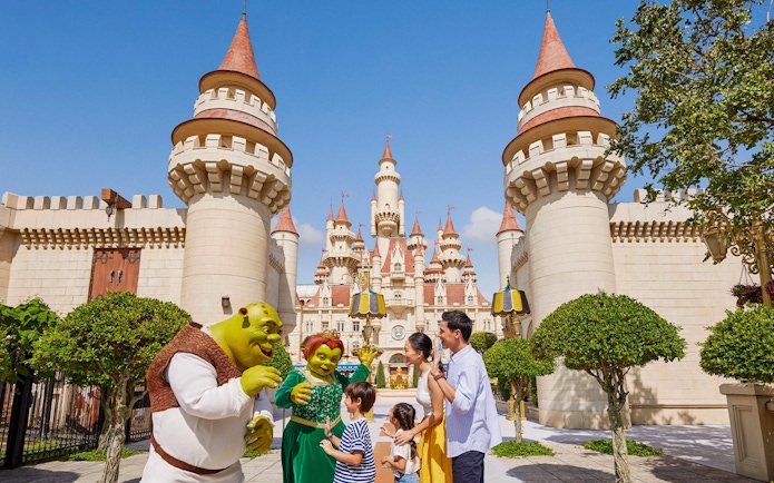 Characters from Shrek interacting with visitors at Universal Studios Singapore.
