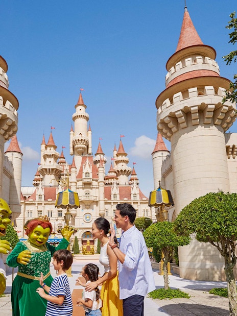 Characters from Shrek interacting with visitors at Universal Studios Singapore.