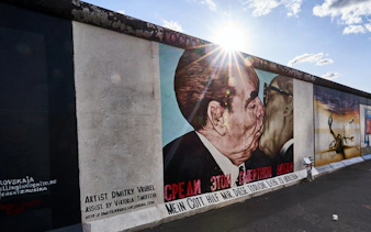 East Side Gallery mural depicting a famous political kiss in Berlin, Germany.
