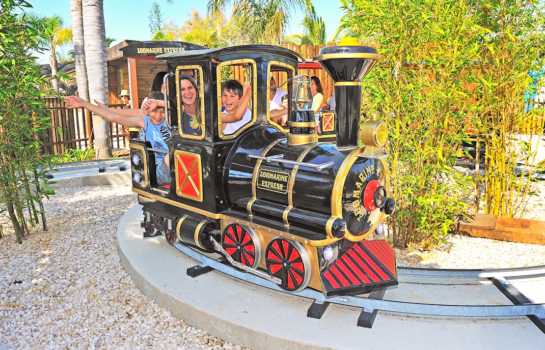 Guests enjoying a ride on the Zoomarine Express roller coaster in Algarve, Portugal.