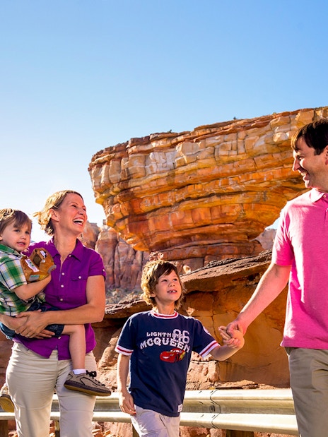 Guests enjoying Frontierland at Disneyland Park, California with rock formations in the background.