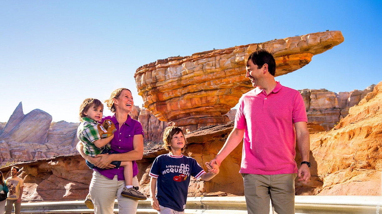 Guests enjoying Frontierland at Disneyland Park, California with rock formations in the background.