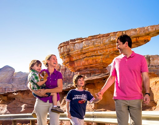 Guests enjoying Frontierland at Disneyland Park, California with rock formations in the background.