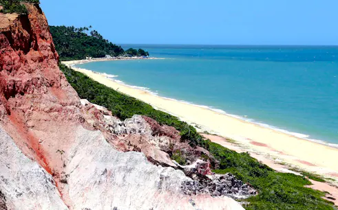 Cliffs and beach at Arraial d'Ajuda, Porto Seguro, with ocean view.