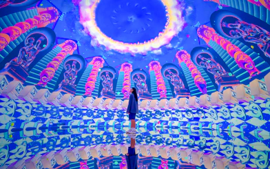Futuristic art installation with neon colors and mirrored reflections at House Of Hype.