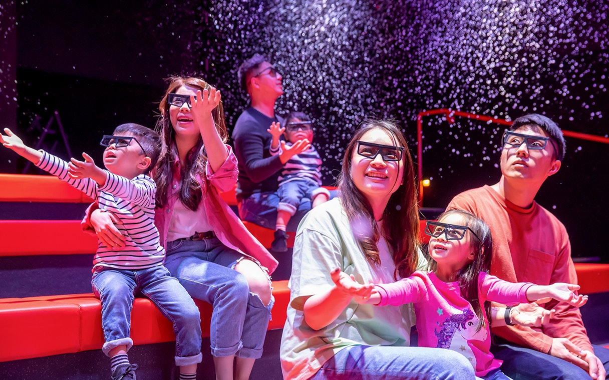 Families enjoying a 4D cinema experience at LEGOLAND® Discovery Centre Hong Kong.