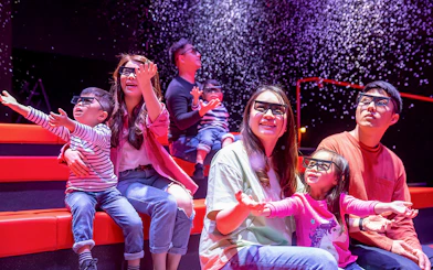 Families enjoying a 4D cinema experience at LEGOLAND® Discovery Centre Hong Kong.