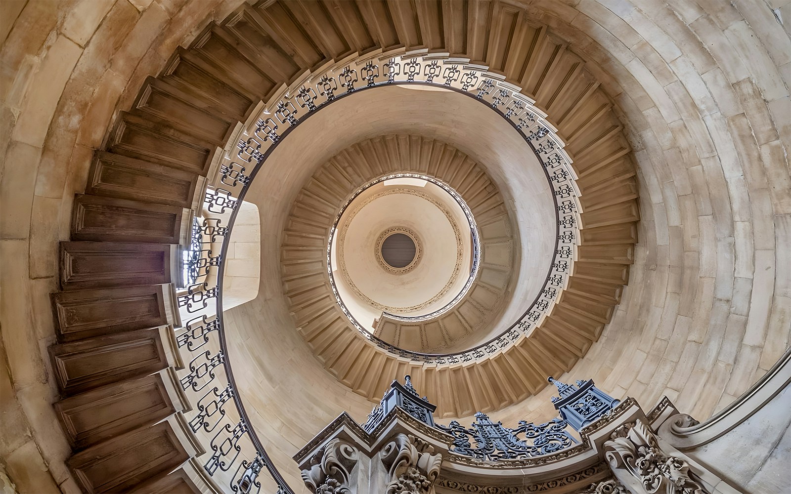 Spiral staircase inside St Paul's Cathedral, London, viewed from below.