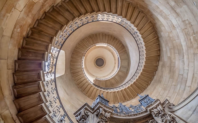 Spiral staircase inside St Paul's Cathedral, London, viewed from below.
