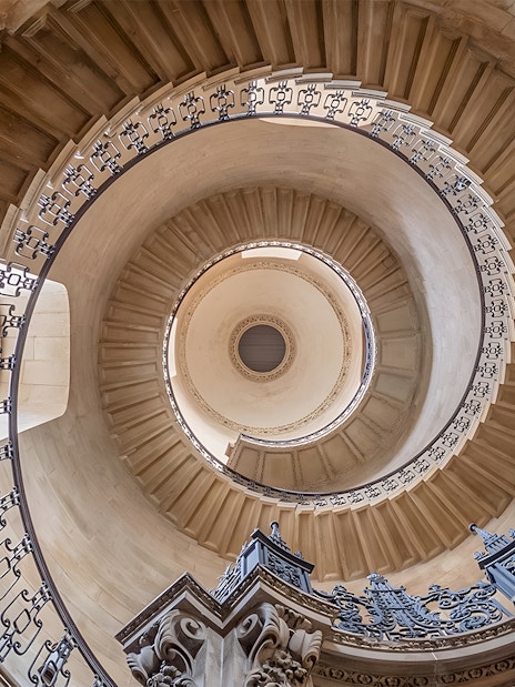 Spiral staircase inside St Paul's Cathedral, London, viewed from below.